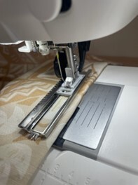 Sewing machine stitching fabric with precision in New South Wales shop.