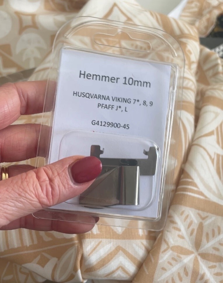 Hemmer foot attachment for Husqvarna and Pfaff sewing machines in packaging.