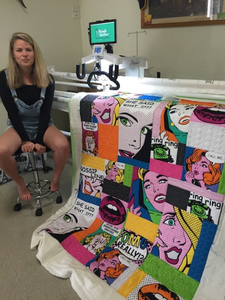 Georgia at the Handi Quilter Avante Machine